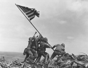 FILE - In this Feb 23, 1945 file photo, U.S. Marines of the 28th Regiment, 5th Division, raise the American flag atop Mt. Suribachi, Iwo Jima, Japan. The Marine Corps said Monday, May 2, 2016, that it has begun investigating whether it mistakenly identified one of the men shown raising the U.S. flag at Iwo Jima in one of the iconic images of World War II after two amateur history buffs began raising questions about the picture. The Marines announced its inquiry more than a year after Eric Krelle, a toy designer from Omaha, Neb., and Stephen Foley, who works at a building supply company in Wexford, Ireland, questioned the identity of one man.