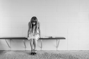 Black and white young woman sitting