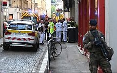 French security and emergency services block the area following a suspected package bomb exploded along a pedestrian street in the heart of Lyon, southeast France, on May 24, 2019. (Philippe Desmazes/AFP)