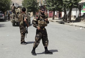 Afghan security forces arrive at the site of Gunmen attack in Kabul, Afghanistan, Thursday, Aug. 16, 2018. Gunmen besieged a compound belonging to the Afghan intelligence service in Kabul on Thursday, police said, as the city's Shiite residents held funeral services for the victims of a horrific suicide bombing the previous day that left 34 dead. (AP Photo/Rahmat Gul)