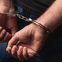 Illustrative image of criminal in handcuffs. (YakobchukOlena/iStock, by Getty Images)