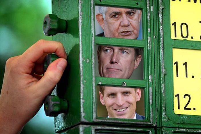 A bookies sign with pictures of Ken Wyatt, Christian Porter and Anne Aly.