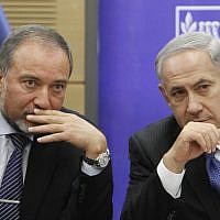 Prime Minister Benjamin Netanyahu and then-foreign minister Avigdor Liberman in the Knesset, February 3, 2014. (Yonatan Sindel/Flash90)