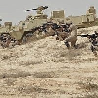 In this undated photo released by Saudi Press Agency, SPA, Saudi military personnel conduct military exercises dubbed Gulf Shield One in Saudi Arabia. (Saudi Press Agency via AP)