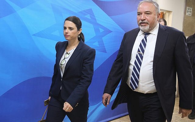 Then-defense minister MK Avigdor Liberman, right, and Justice Minister Ayelet Shaked arrive for the weekly cabinet meeting at the Prime Minister's Office, in Jerusalem on June 17, 2018. (Marc Israel Sellem/POOL/File)