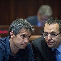 Blue and White Knesset members Yoaz Hendel (L) and Zvi Hauser seen at the Knesset Plenary Hall, ahead of the opening Knesset session of the new government on April 29, 2019. (Noam Revkin Fenton/Flash90)