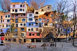 The central Hundredtwasserhaus apartment block with its colourful higgledy-piggledy façade revealing the influence ...