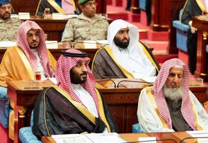 In this photo provided by the Saudi Press Agency, SPA, Crown Prince Mohammed bin Salman, front row on left, seated next to the country’s most senior cleric, listens to Saudi King Salman give his annual policy speech in the ornate hall of the consultative Shura Council, Monday, Nov. 19, 2018, Riyadh, Saudi Arabia.