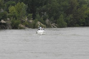 A police boat takes part in the seaach operation for survivors on the Danube River in downtown Budapest, Hungary, Thursday, May 30, 2019, after a sightseeing boat sank.