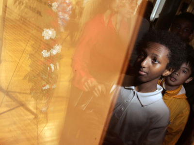 Schoolchildren line up to see an original copy of the Emancipation Proclamation signed by President Abraham Lincoln during the documents unveiling at the African American Civil War Memorial Museum, May 20, 2005, in Washington, D.C.