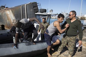 Coast Guard rescue illegal migrants off the coast of Tripoli and transfer them to the seaport, Friday, March. 3, 2017.