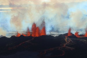 In this aerial view, fountains of lava, up to 60 meters high, spurt from a fissure in the ground on the north side of the Bardarbunga volcano in Iceland, Tuesday, Sept. 2, 2014.