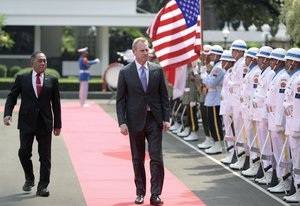 Acting U.S. Secretary of Defense Patrick Shanahan, center, accompanied by   Indonesian Defense Minister Ryamizard Ryacudu, left, inspects honor guards during their meeting in Jakarta, Indonesia, Thursday, May 30, 2019. (AP Photo/Dita Alangkara)