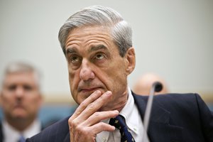 FBI Director Robert Mueller listens as he testifies on Capitol Hill in Washington, Thursday, June 13, 2013, as the House Judiciary Committee held an oversight hearing on the FBI.