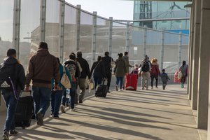 Migrants seeking asylum are assisted by CBP Officers at the San Ysidro Port of Entry prior to the adjudication of their cases