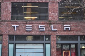 29 December 2013, Tesla logo, Tesla Motors store, 435 Westlake Ave. N., Seattle, Washington, USA.