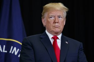 President Donald Trump listens during a swearing-in ceremony for incoming Central Intelligence Agency director Gina Haspel at CIA Headquarters, Monday, May 21, 2018, in Langley, Va.