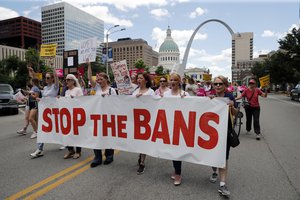 Abortion-rights supporters march Thursday, May 30, 2019, in St. Louis.