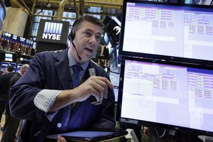 Trader William McInerney works on the floor of the New York Stock Exchange, Monday, Nov. 14, 2016. Stocks are opening modestly higher on Wall Street