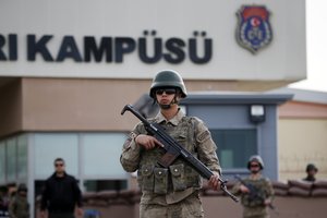 Members of Turkish forces guard the entrance to the prison complex in Aliaga, Izmir province, western Turkey, where jailed U.S. pastor Andrew Craig Brunson is held and is appearing on his trial at a court inside the complex, Monday, April 16, 2018.