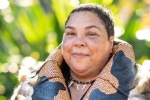 Theresa Ardler proudly wears the budbili, or possum-skin cloak that she made herself.