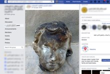 A Facebook page showing a burned statue head for sale