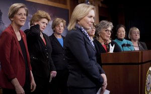 From left, Sen. Elizabeth Warren, D-Mass., Sen. Debbie Stabenow, D-Mich., Sen. Tammy Baldwin, D-Wis., Sen. Kristen E. Gillibrand, D-NY., Sen. Amy Klobuchar D-Minn., Sen. Barbara Boxer, D-Calif., Sen. Mazie Hirono, D-Hawaii, and Sen. Patty Murray, D-Wash., participate on a joint news conference on Capitol Hill in Washington, Thursday, Jan. 30, 2014, to show their support on raising the federal minimum wage.