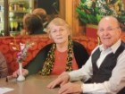 Spyro and Toula, pictured sitting in one of the booths at the Cosmopolitan Cafe in Bondi Junction