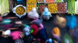 Blurred motion of people at a marketplace