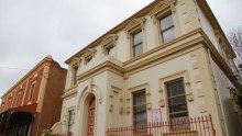 A wide shot of the exterior of the former Commercial Banking Company building.