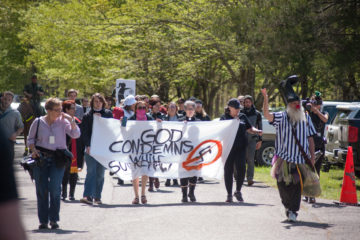 Anti-fascist and anti-racist activists march outside a conference held by the white supremacist magazine, American Renaissance. (Photo by Aaron Cynic)