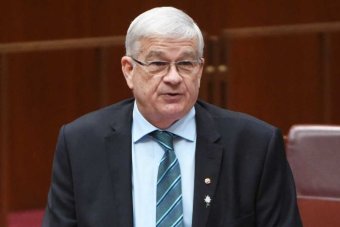 One Nation Senator Brian Burston makes his maiden speech in the Senate, Pauline Hanson sits in front.