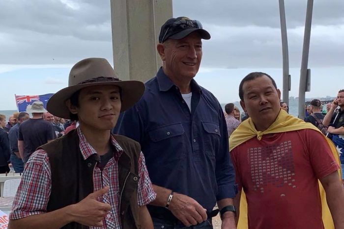 Senator Fraser Anning poses with activists in St Kilda.