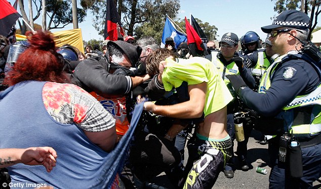 Protesters from Reclaim Australia and the No Room for Racism group clash during a rally on Sunday