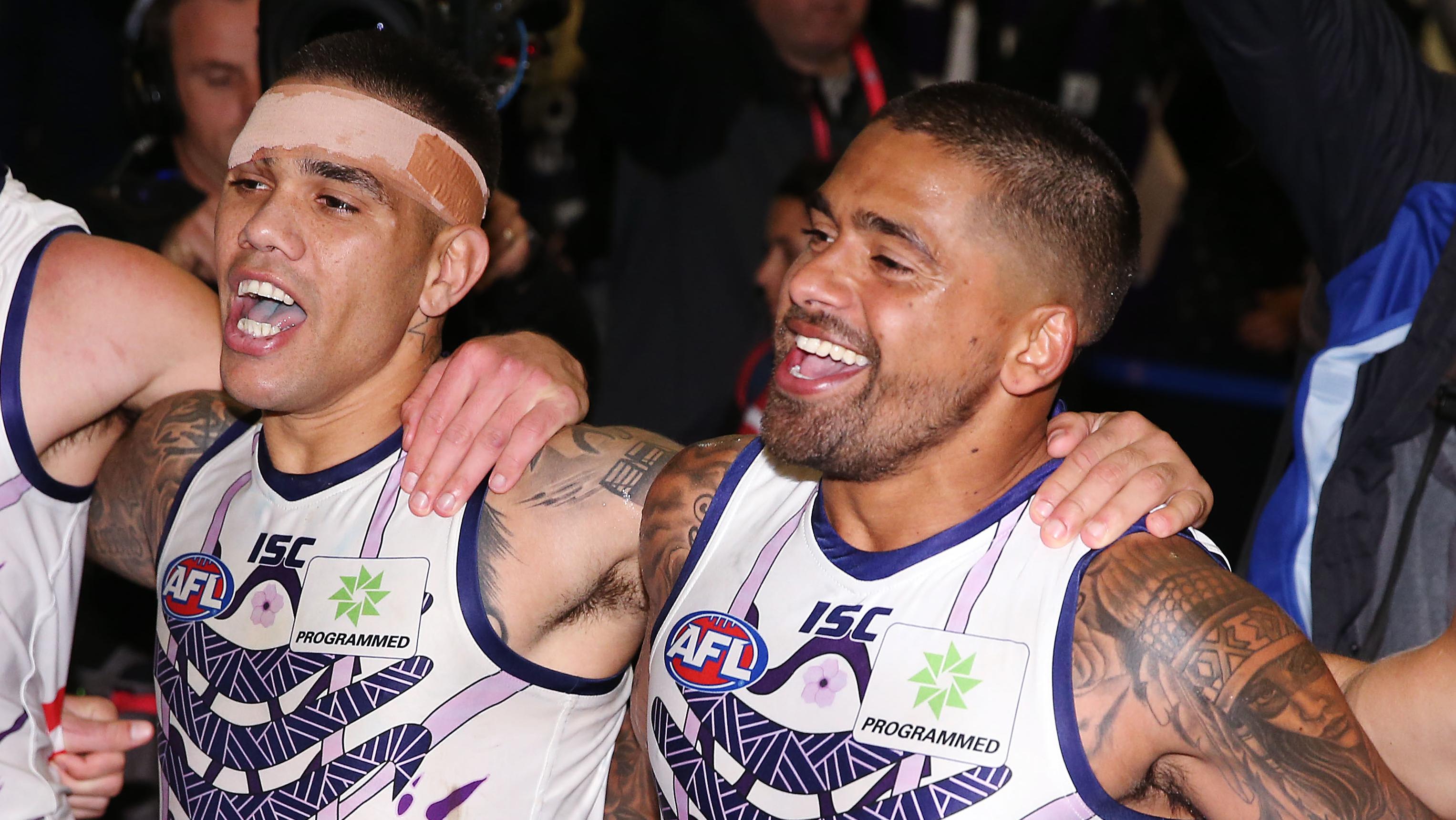 Michael Walters celebrates the win with Bradley Hill.