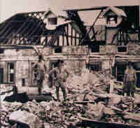 Australian troops in Darwin surveying the damage caused by the first Japanese air raid