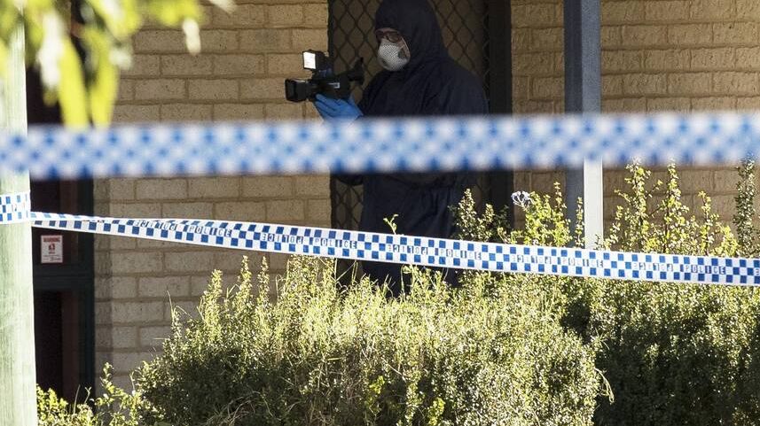 Forensic police scour a home in Queens Park after Alistair Wilson was found dead.