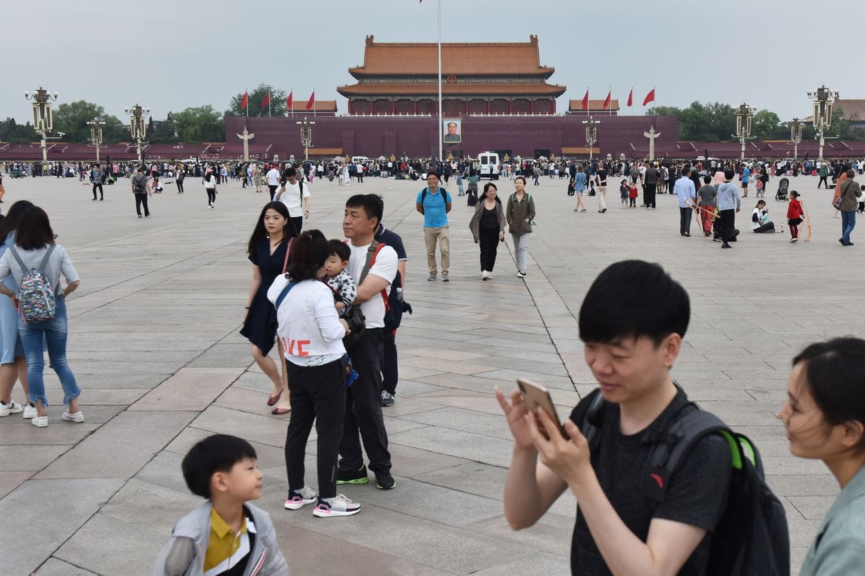 People gather at Tiananmen Square in Beijing on May 18 (Greg Baker/AFP)