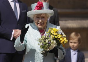 Britain's Queen Elizabeth II waves to the public as she leaves after attending the Easter Mattins Service at St. George's Chapel, at Windsor Castle in England Sunday, April 21, 2019.