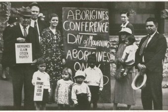 Bill Ferguson holds sign that reads 'Aborigines claim citizens rights'.