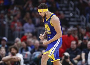 Golden State Warriors guard Klay Thompson celebrates after scoring a three pointer against the Chicago Bulls during the second half of an NBA basketball game, Monday, Oct. 29, 2018, in Chicago