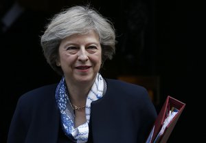 Britain's Prime Minister Theresa May leaves 10 Downing Street for the House of Commons for her weekly Prime Minister's Questions, in London, Wednesday, Oct. 12, 2016.