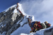 A photo of climbers lining up at the summit of Mount Everest has sparked a debate over deaths and traffic jams.