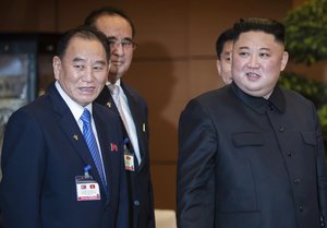 North Korean leader Kim Jong Un, center, stands with Nguyen Thi Kim Ngan, chairwoman of Vietnam's National Assembly, and Kim Yong Chol, vice chairman of Workerʼs Party of Korea, at the National Assembly in Hanoi, Vietnam,  Friday, March 1, 2019.