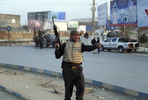 Afghan security forces arrive at the site of an explosion and attack by gunmen, in Kabul, Afghanistan, Monday, Dec. 24, 2018.