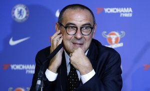 Maurizio Sarri, the new Chelsea football team manager, listens at a press conference to introduce him at Stamford Bridge stadium in London, Wednesday, July 18, 2018.