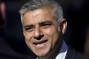 Labour party candidate for Mayor of London Sadiq Khan gives a television interview during a campaign event to highlight the choices Londoners face at the London mayoral elections, in the Canary Wharf business district at London, Wednesday, May 4, 2016.