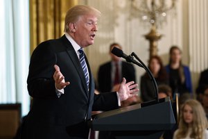 President Donald Trump speaks during an event on prison reform in the East Room of the White House, Friday, May 18, 2018, in Washington. Trump and his supporters are circulating an explosive theory: The FBI, they say, may have planted a mole inside their campaign to bring him down.