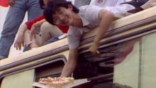 A man hands out cake in Tiananmen Square