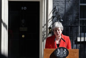 British Prime Minister Theresa May reacts as she makes a speech in the street outside 10 Downing Street in London, England, Friday, May 24, 2019.